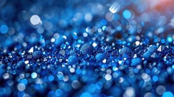 Vivid blue glitter shimmers and sparkles under soft lighting, creating a mesmerizing effect photo