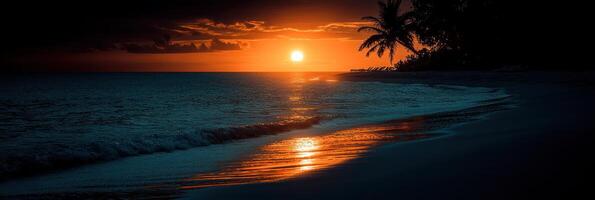 A tranquil sunset casts vibrant colors over the ocean and beach photo
