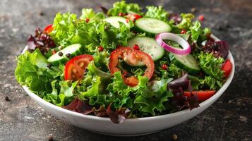 Crisp lettuce, vibrant tomatoes, and sliced cucumbers create a refreshing salad photo