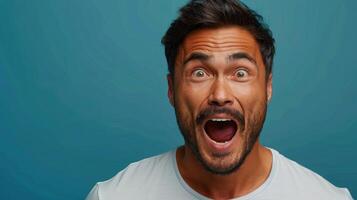 A man with a joyful expression showcases his excitement with an open mouth photo
