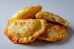 Golden Brown Empanadas with a Crispy Crust and a Creamy Filling photo