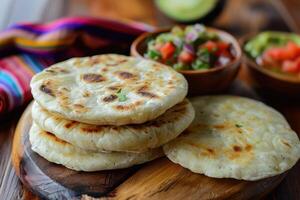 Stacked Grilled Tortillas with a Side of Salsa and Guacamole photo