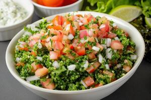 Close-up of Tabbouleh Salad in a White Bowl photo