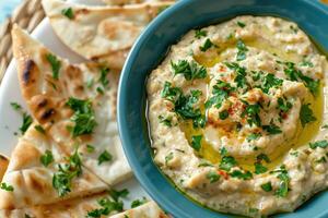 Creamy White Bean Dip with Pita Bread and Parsley Garnish photo