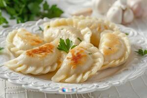 Golden-Brown Fried Dumplings on a White Plate photo