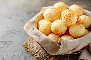A Basket of Golden-Brown Cheese Bread Rolls photo
