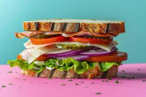 A Multi-Layered Sandwich with Lettuce, Tomato, Red Onion, and Pickles photo