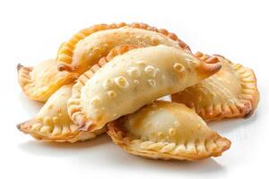 A Pile of Golden Brown Empanadas with Flaky Crust photo