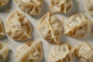 A Close-Up View of Steamed Dumplings on a White Plate photo