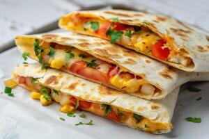 Close-up of Three Cheesy Quesadillas with Tomatoes and Corn photo