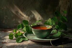 Green Teacup with Flower and Leaves on Rustic Surface photo