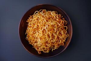 Bowl of Cooked Instant Noodles with Spicy Sauce photo