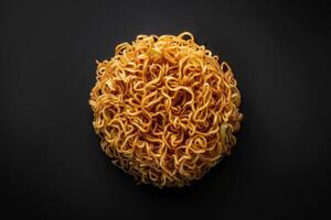 A Close-Up of Cooked Instant Noodles on a Black Background photo