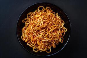 Close-up of Cooked Noodles in a Black Bowl photo
