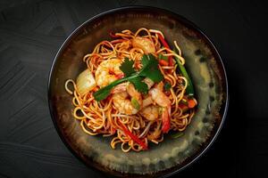 A Plate of Shrimp Stir-Fry Noodles with Vegetables and Parsley photo