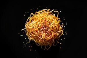 A Plate of Spicy Noodles with Sesame Seeds and Herbs photo