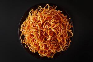 Bowl of Cooked Ramen Noodles with Sauce photo