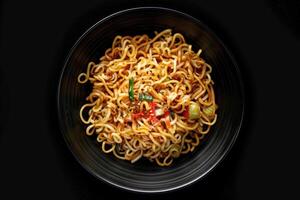 A Plate of Noodles with Green Onions and Red Peppers photo