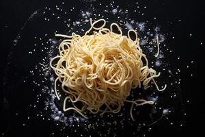 Noodles with Sesame Seeds on a Black Background photo