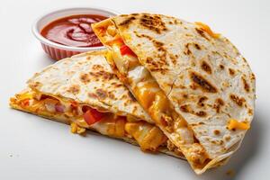 Two Grilled Quesadillas with Cheese, Vegetables, and Salsa photo