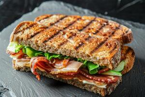 Grilled Bread Sandwich with Bacon, Lettuce, Cucumber, and Cheese photo