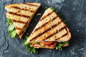 Grilled Ham and Tomato Sandwich with Lettuce and Pickles photo
