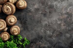 Fresh Brown Mushrooms and Parsley on a Dark Background photo