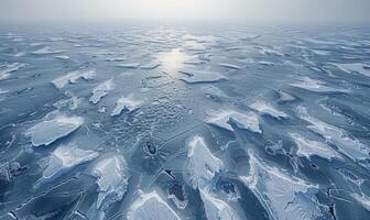The frozen surface of the Arctic Ocean at the North Pole, with intricate patterns of ice and snow photo