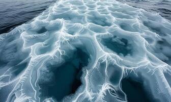 The frozen surface of the Arctic Ocean at the North Pole, with intricate patterns of ice and snow photo