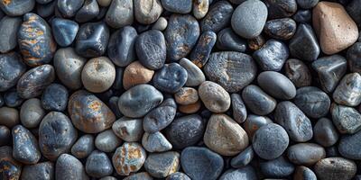 Texture of smooth pebbles on a beach photo