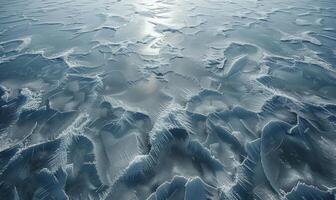 The frozen surface of the Arctic Ocean at the North Pole, with intricate patterns of ice and snow photo