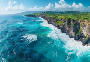A picturesque coastline with turquoise waves crashing against rugged cliffs photo