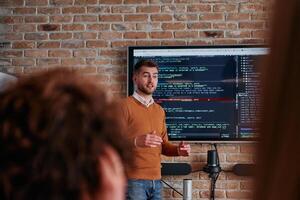 In a corporate setting businessman leads a meeting, passionately presenting a business plan to his attentive team, fostering collaboration and strategic thinking photo