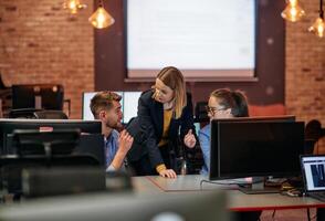 Strategic Business Meeting. Group of Professionals Collaborating in Office Using Computers photo
