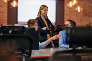 Strategic Business Meeting. Group of Professionals Collaborating in Office Using Computers photo