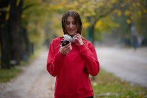 Athletic young woman taking a breath and relaxing after jogging and stretching. Woman Training and Workout Exercises On Street. photo