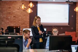Strategic Business Meeting. Group of Professionals Collaborating in Office Using Computers photo