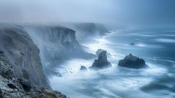 Windy coastal cliffs with rugged rock formations overlooking rough seas under an overcast sky, creating a dramatic seascape. photo