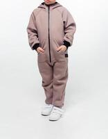 Child wearing a taupe zip-up jumpsuit photo