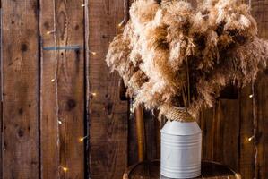 Pampas Grass in Metal Jug with Garland photo