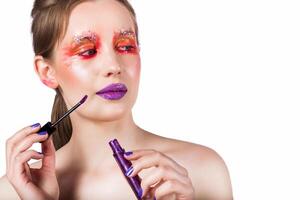 Bold Purple Lip Gloss Application Close-Up photo