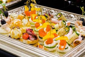 Assorted Finger Foods on Silver Tray photo