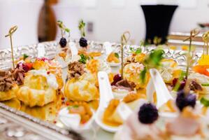 Assorted Canapes on Elegant Silver Tray photo
