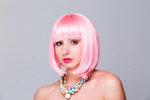 Portrait of Woman with Pink Hair and Necklace photo