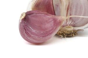 Fresh single garlic clove isolated on a white background photo