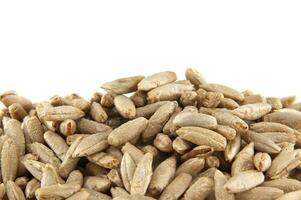 Pile of rye grains isolated on a white background photo