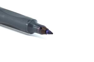 Close-up of black permanent marker with white background for office and art use photo