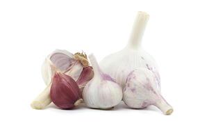 Garlic bulbs of varying sizes isolated on white background photo