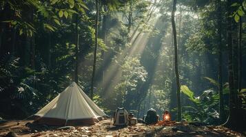 Camping in lush forest with big white tent, gear scattered around, sunlight filtering through trees, dappled shadows. Big camping tent gears photo
