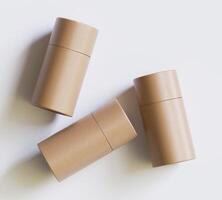 Brown Paper tube package mockups isolated on white background. Blank craft carton circular realistic tube texture. Cylindrical container with cap for product branding photo
